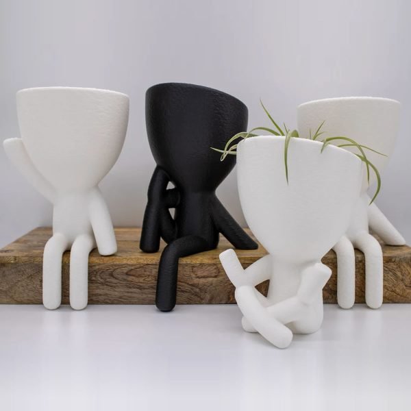 sitting people planter